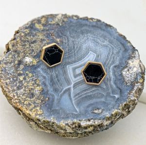 Hexagon black marble stone studs.